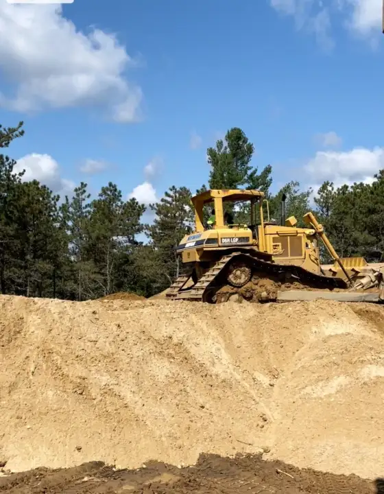 Bulldozer on a graded sand site