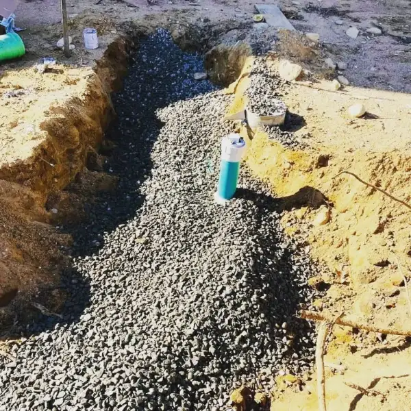 Stone-filled trench with pipe
