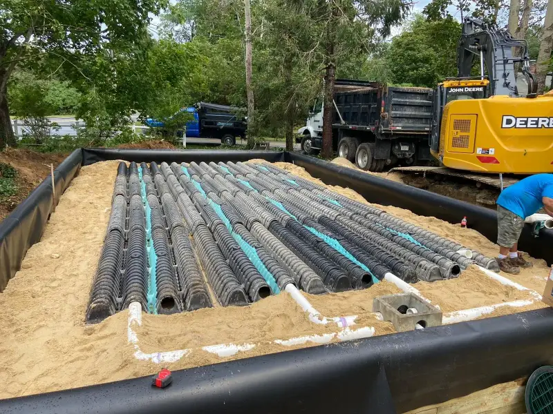 Leaching chambers laid out in sand for a septic installation