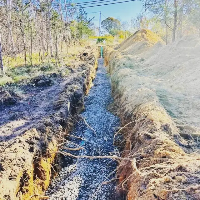 Open trench with stone and pipe for a sewer connection